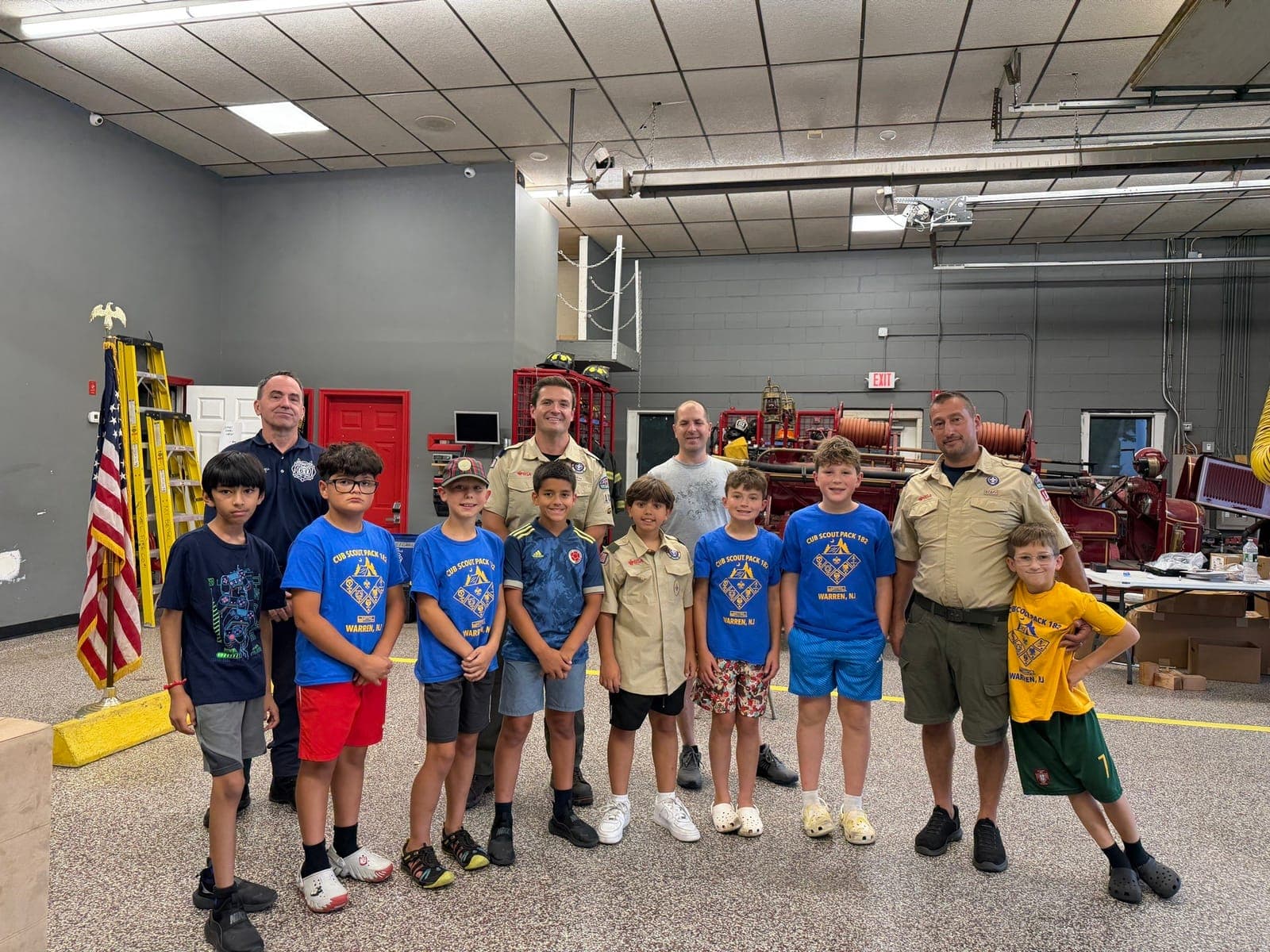 Cub Scout Pack 182 members and adults gather at Mt. Bethel Firehouse during the Arrow of Light den’s first aid visit.